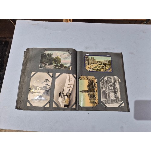 450 - A box of assorted photograph and postcard albums.