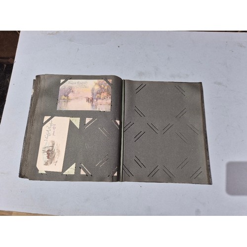 450 - A box of assorted photograph and postcard albums.