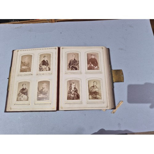 450 - A box of assorted photograph and postcard albums.