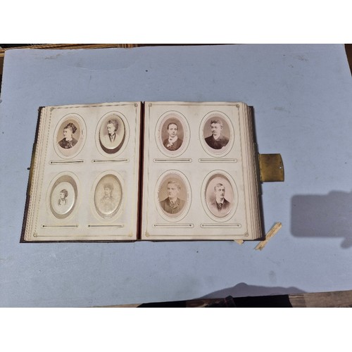 450 - A box of assorted photograph and postcard albums.