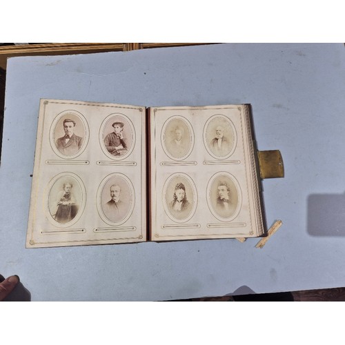 450 - A box of assorted photograph and postcard albums.