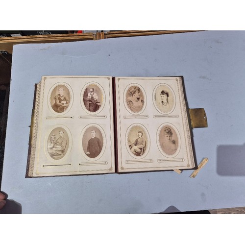 450 - A box of assorted photograph and postcard albums.