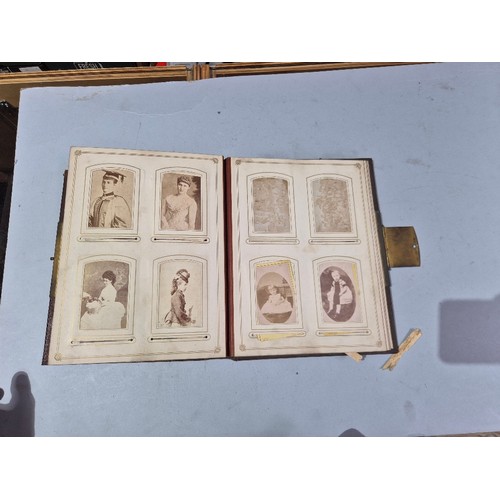 450 - A box of assorted photograph and postcard albums.