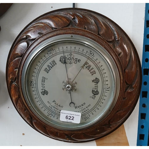An oak framed barometer.