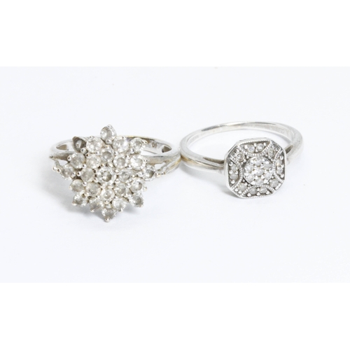 129 - Two diamond cluster rings, one with 9ct gold convention marks, the other unmarked, gross weight 5.6g... 