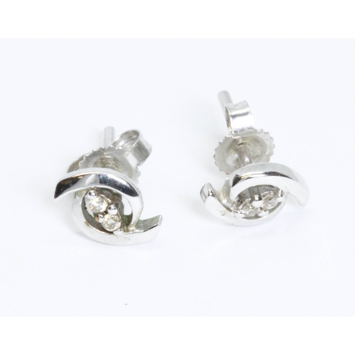 71 - A pair of diamond studs, marked '9K', gross weight 1g.