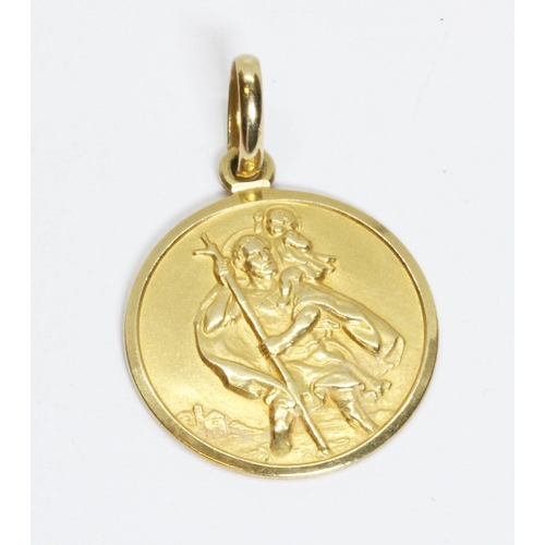 138 - An Italian double side medallion, one side with St Christopher and the other a sports car on a mount... 