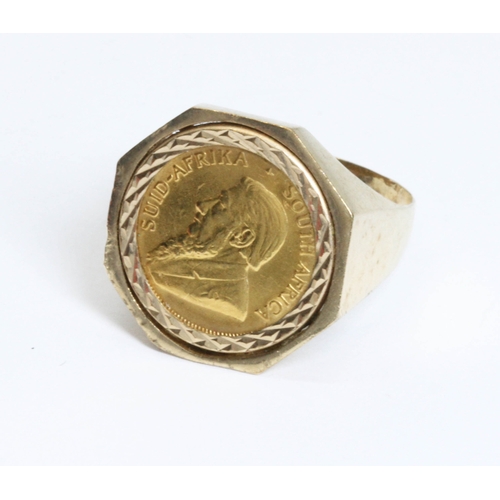 141 - A hallmarked 9ct gold signet ring set with a 1/10th krugerrand, gross weight 7.5g, size V.