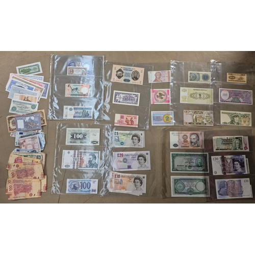 A collection of assorted world banknotes.