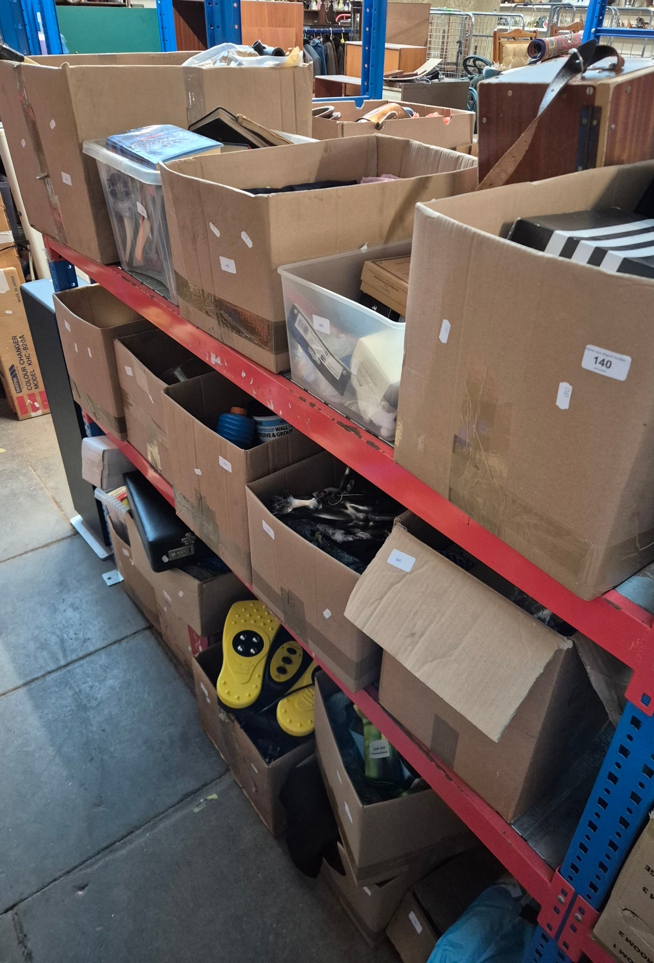 18 boxes of mixed items including soaps, books, hand pump, tennis ...