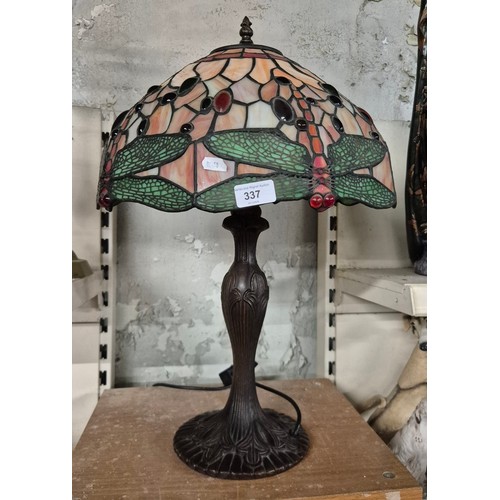 337 - A metal table lamp with Tiffany style shade