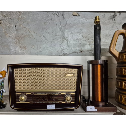 330 - A maroon bakelite Stella wireless set and a cable sample table lamp