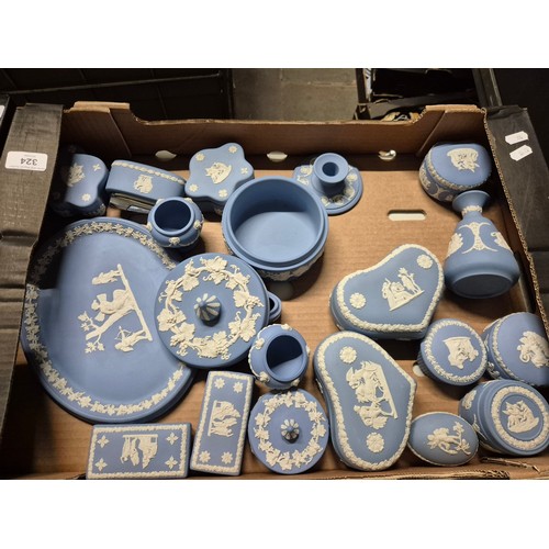 324 - A box of assorted blue Wedgwood Jasperware.