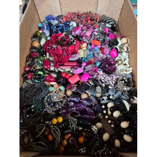 439 - A box of assorted beaded costume jewellery.