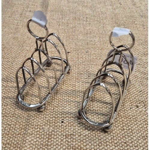456 - A pair of hallmarked silver toast racks.