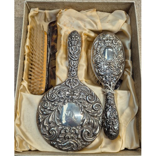 462 - A hallmarked silver dressing table set.
