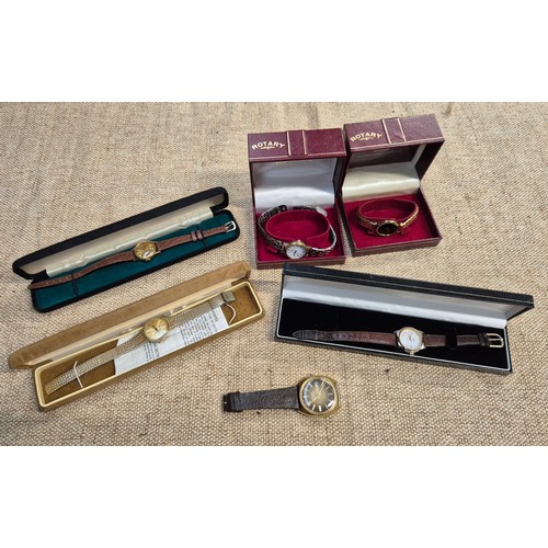 463 - A box containing Five boxed watches and one other including Rotary, Tissot and Bulova etc