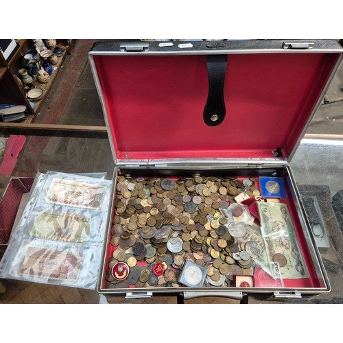 470 - A briefcase of assorted world coins, banknotes & badges etc.