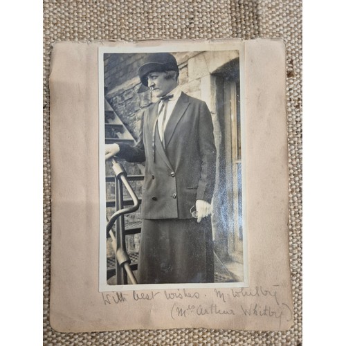 445 - A vintage autograph book with various signed photos etc.