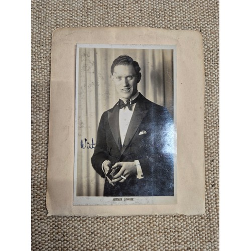 445 - A vintage autograph book with various signed photos etc.