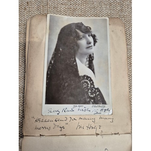 445 - A vintage autograph book with various signed photos etc.