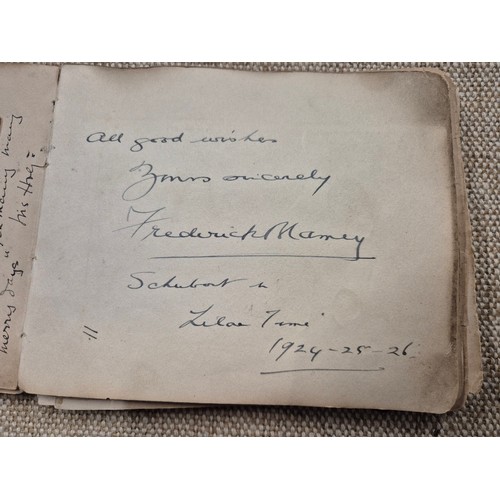 445 - A vintage autograph book with various signed photos etc.