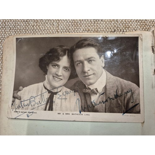 445 - A vintage autograph book with various signed photos etc.