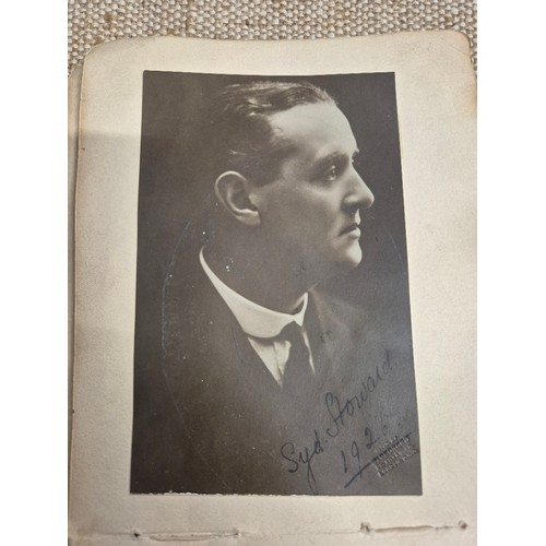 445 - A vintage autograph book with various signed photos etc.