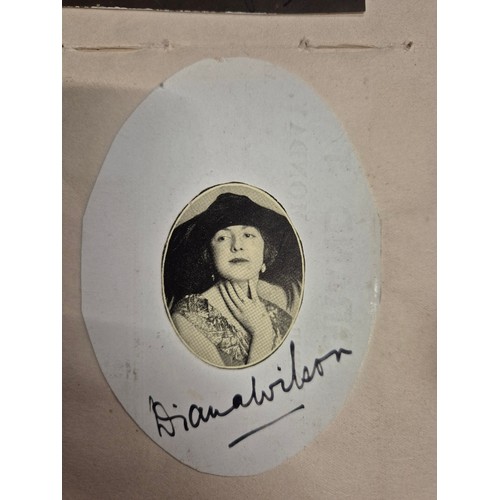 445 - A vintage autograph book with various signed photos etc.