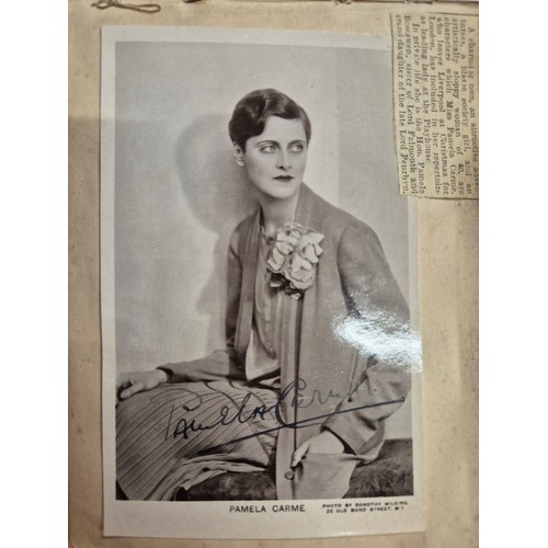 445 - A vintage autograph book with various signed photos etc.