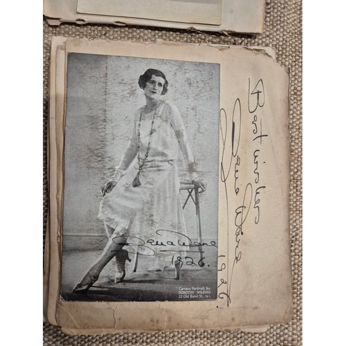 445 - A vintage autograph book with various signed photos etc.