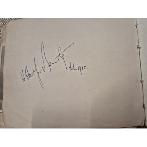 445 - A vintage autograph book with various signed photos etc.