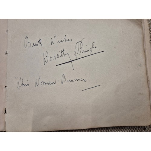 445 - A vintage autograph book with various signed photos etc.