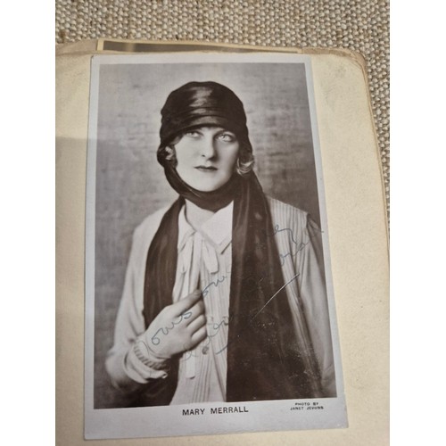 445 - A vintage autograph book with various signed photos etc.