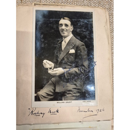 445 - A vintage autograph book with various signed photos etc.