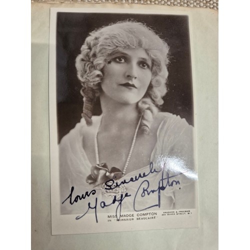 445 - A vintage autograph book with various signed photos etc.