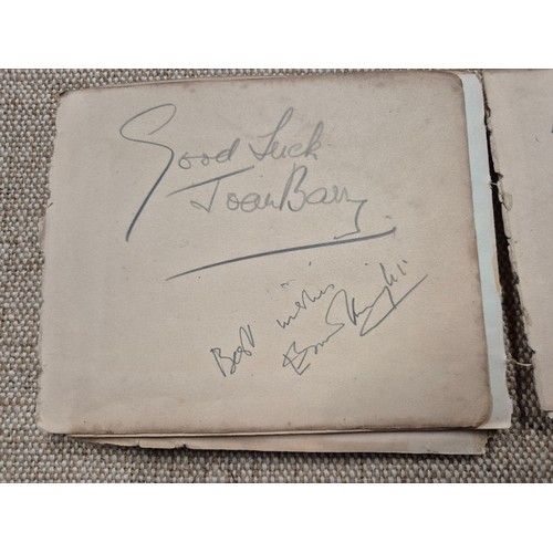 445 - A vintage autograph book with various signed photos etc.