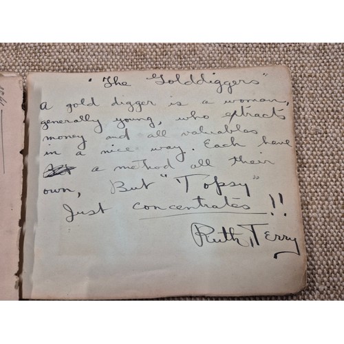 445 - A vintage autograph book with various signed photos etc.