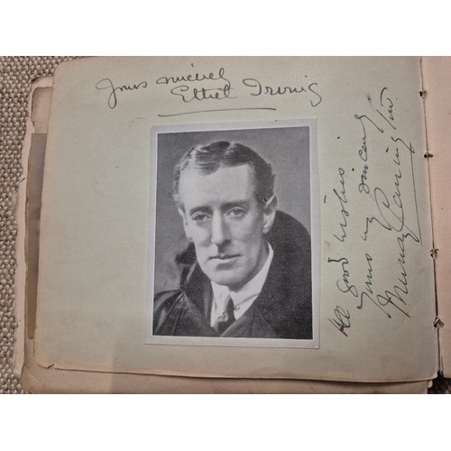 445 - A vintage autograph book with various signed photos etc.