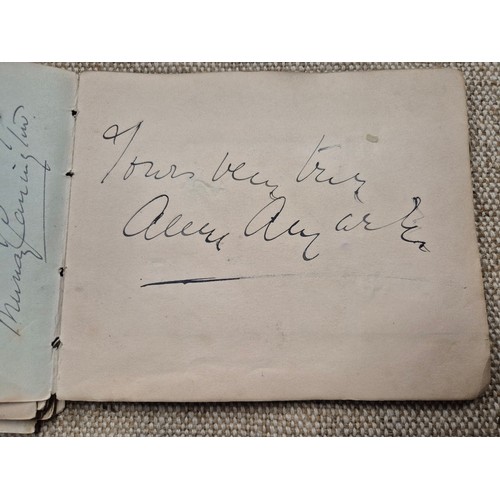 445 - A vintage autograph book with various signed photos etc.