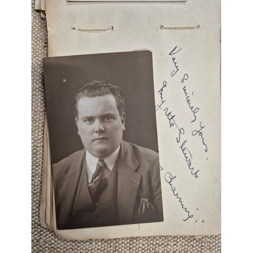 445 - A vintage autograph book with various signed photos etc.