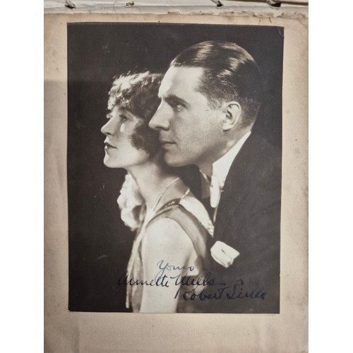 445 - A vintage autograph book with various signed photos etc.