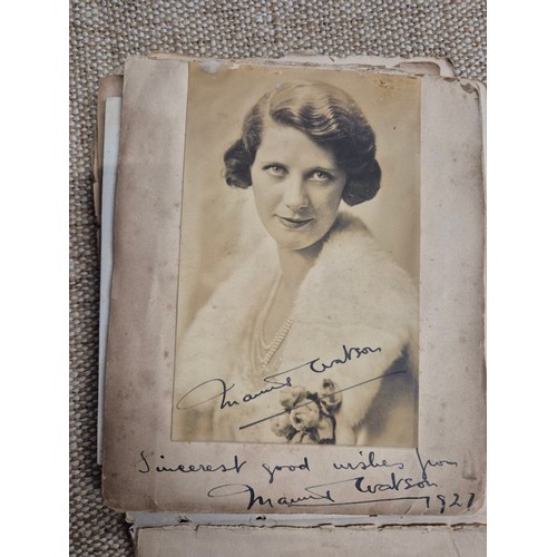 445 - A vintage autograph book with various signed photos etc.