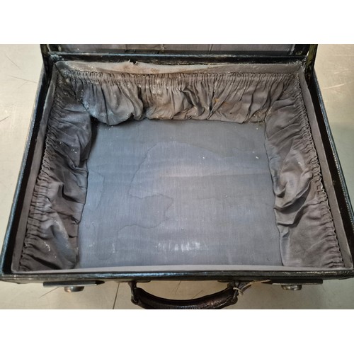 26 - A brown leather case by Drew & Sons, 'to the Royal Family', and a small Gladstone bag