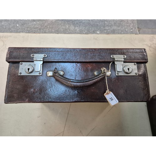 26 - A brown leather case by Drew & Sons, 'to the Royal Family', and a small Gladstone bag