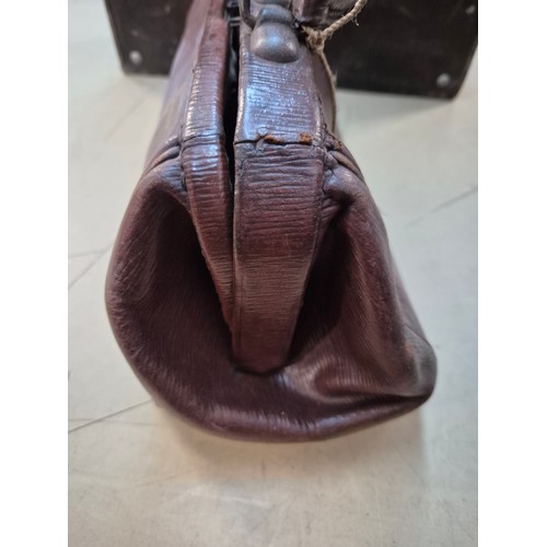 26 - A brown leather case by Drew & Sons, 'to the Royal Family', and a small Gladstone bag