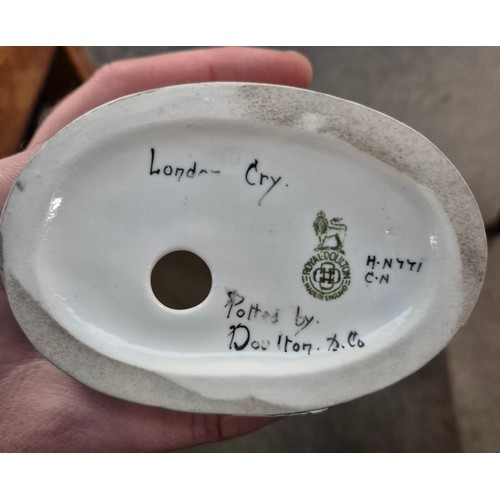 329 - A pair of rare Royal Doulton figures London Cry, HN771 and HN772.