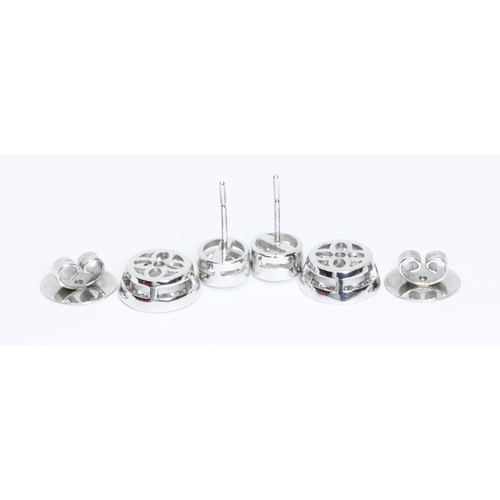 419G - BOODLES, a pair of diamond cluster earrings, the central round brilliant cut stones weighing approxi... 