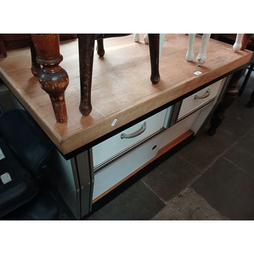 A retro kitchen unit with butcher's block type top.