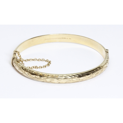 11 - A 9ct gold bangle, convention marks, diameter 58mm, weight 8g.
